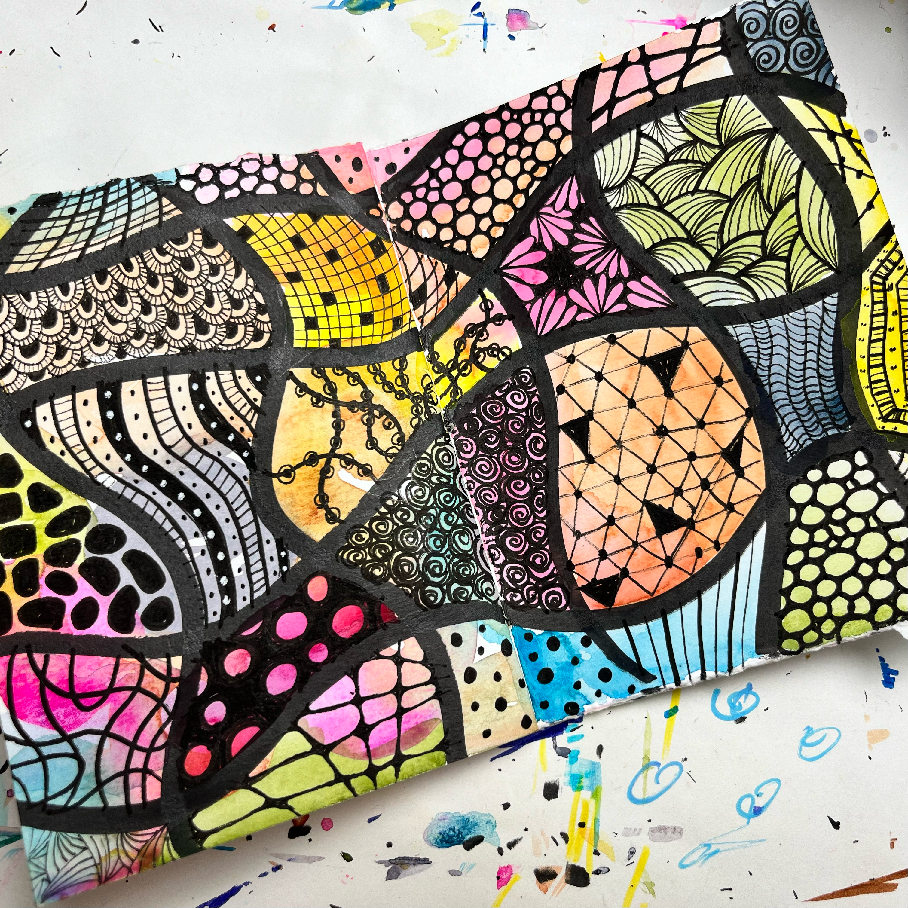 Layered watercolor and doodle art journal spread